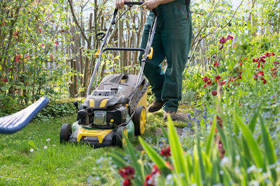 Low section of man working on field