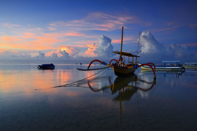 Traditional bali boat with sunrise view at sanur bali