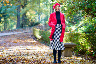 Full length of young woman standing on field