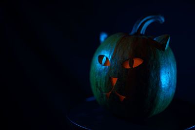 Close-up of jack o lantern against black background