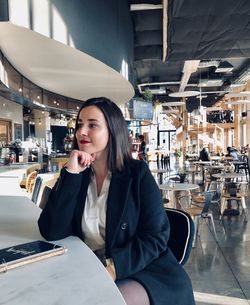 Woman in a bar waiting for her date 