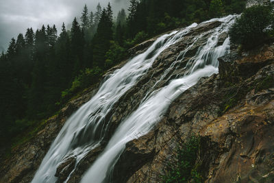 Scenic view of waterfall in forest