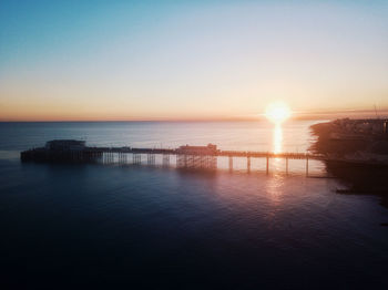 Scenic view of sea against clear sky during sunset