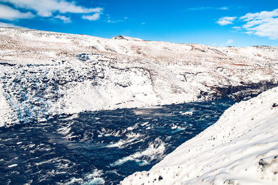 Scenic view of sea against sky during winter