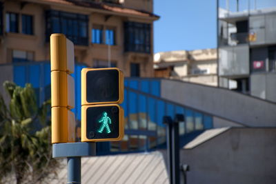 Close-up of road signal in city