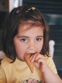 Portrait of cute girl eating ice cream