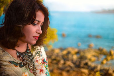 Portrait of beautiful young woman on beach