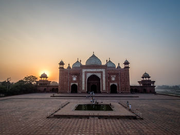 View of historic building against sky at sunset