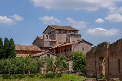 Old building in field against sky