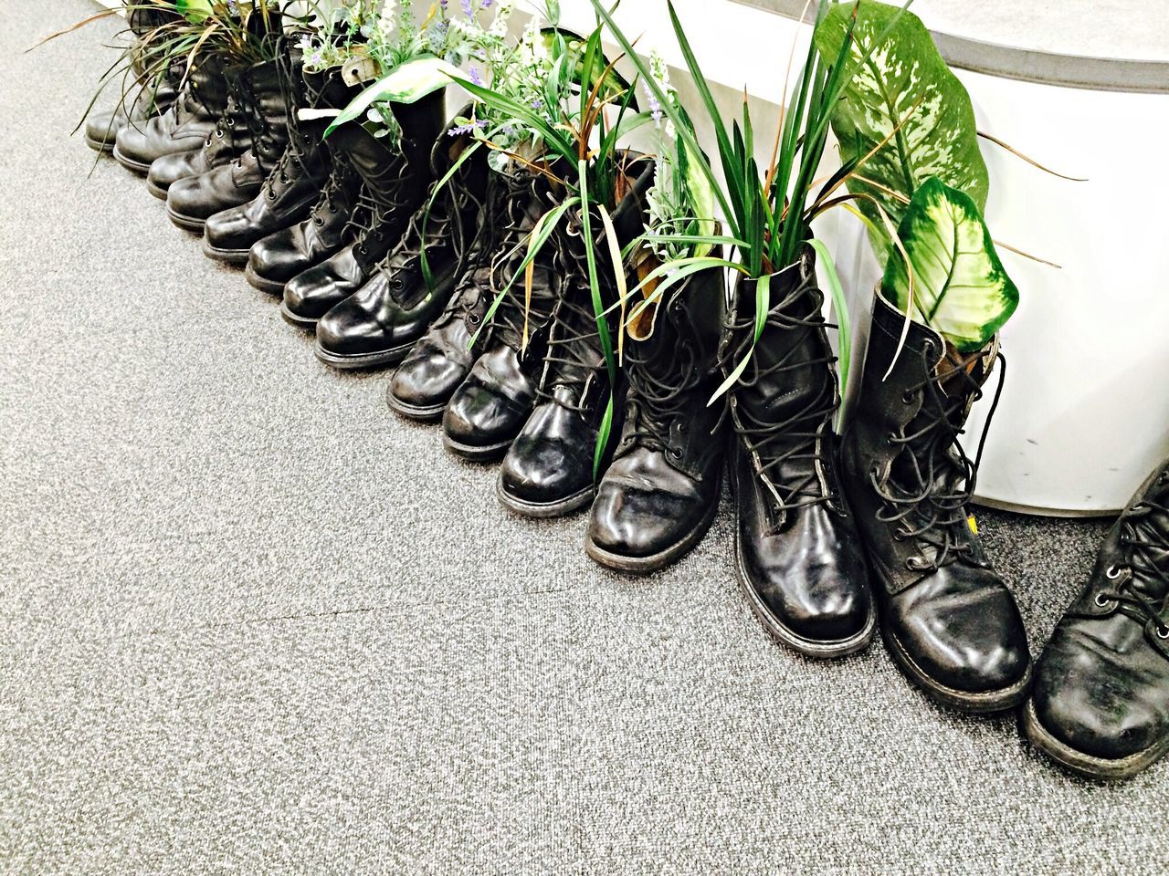 high angle view, shoe, potted plant, still life, flooring, side by side, metal, indoors, footwear, in a row, no people, street, sidewalk, floor, day, tiled floor, close-up, absence, footpath