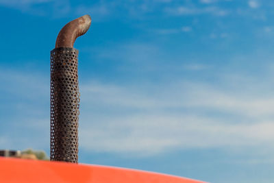 Close-up of metal structure against sky