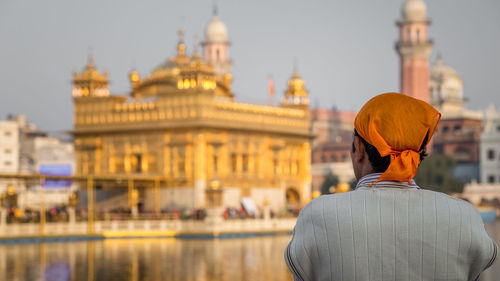 Rear view of man at golden temple