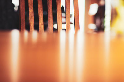 Close-up of metallic chairs at table