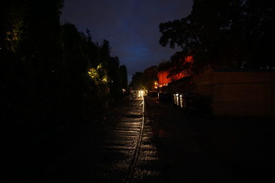 Illuminated tunnel at night