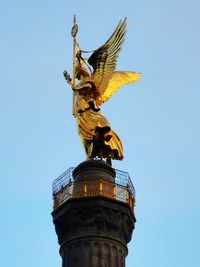 Low angle view of statue against clear sky