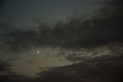 Low angle view of moon in sky at night