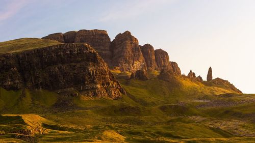 Rock formation on mountain against sky