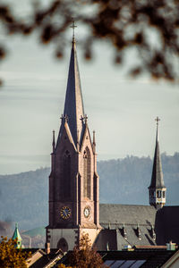 Church amidst buildings against sky