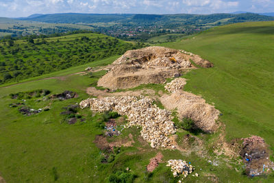 Aerial drone view of excavator working in a limestone quarry