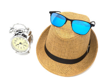 High angle view of sunglasses on paper over white background