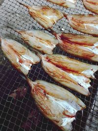 High angle view of meat on barbecue grill