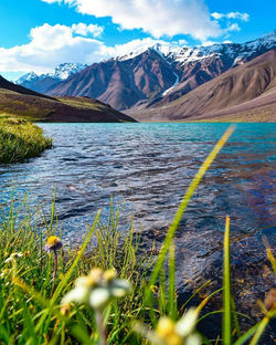 Scenic view of lake and mountains against sky