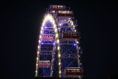 Low angle view of illuminated sky at night