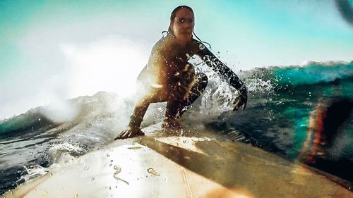 Man splashing water in sea