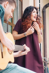 Young woman playing guitar