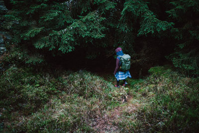 Full length of man walking in forest