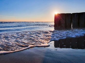 Scenic view of sea against sky during sunset