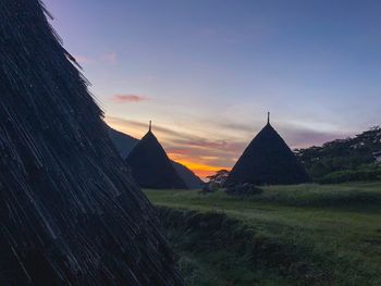 Scenic view of field against sky during sunset