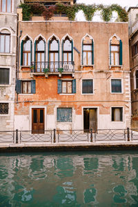 Reflection of old building in swimming pool