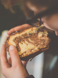 Close-up of hand holding cake