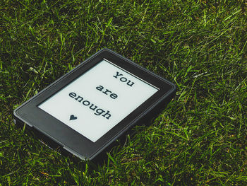 High angle view of information sign on field