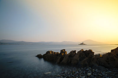 Scenic view of sea at sunset