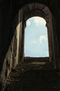 Low angle view of old ruins against sky