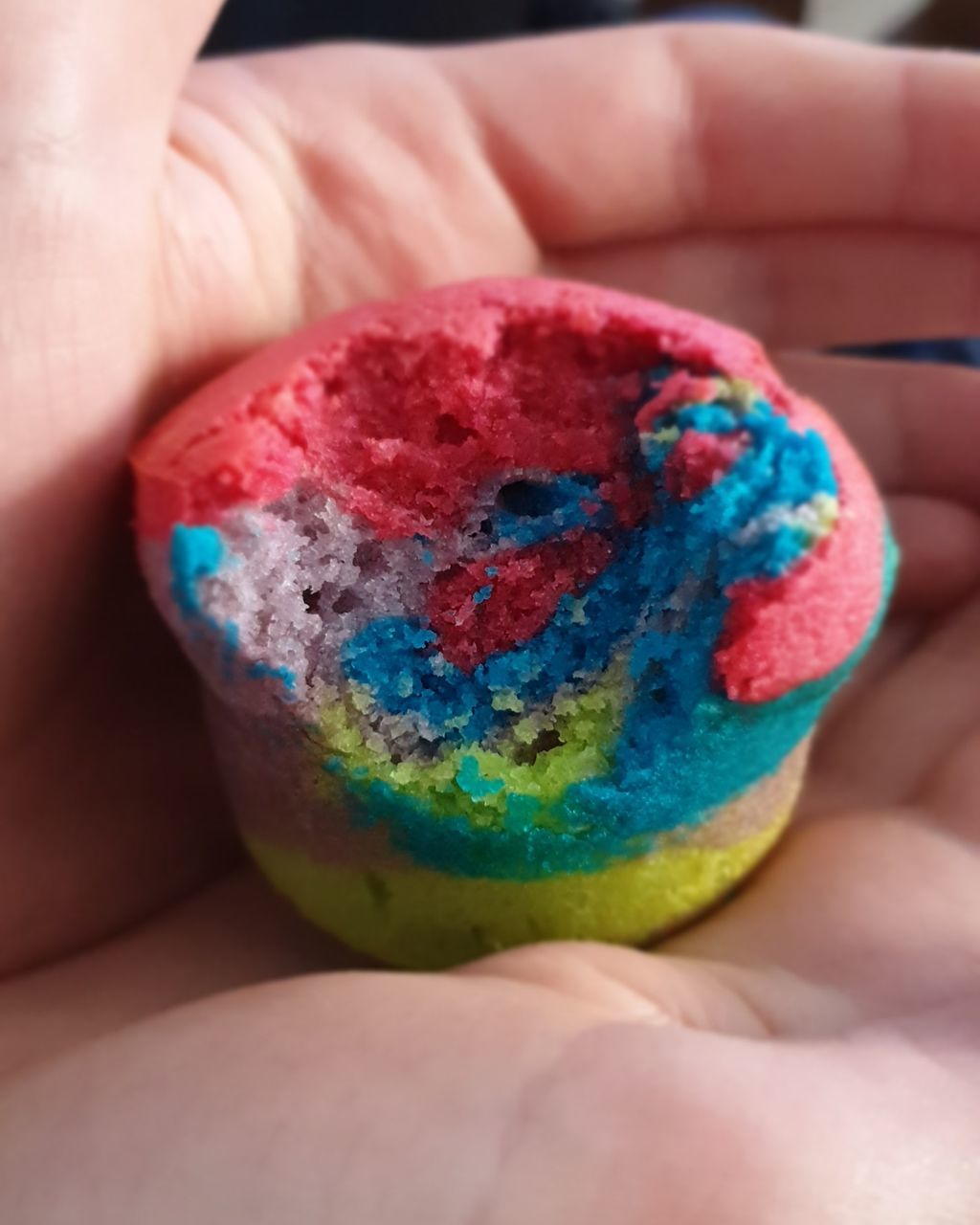 CLOSE-UP OF HUMAN HAND HOLDING MULTI COLORED CANDIES