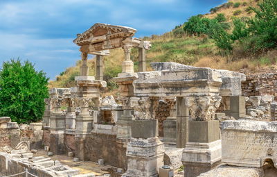 Old ruins of temple against cloudy sky