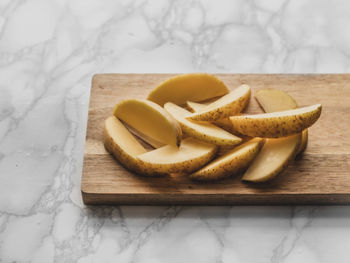 High angle view of chopped bread on cutting board