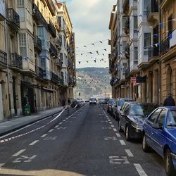 Road in city against sky