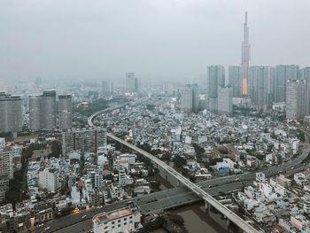 High angle view of modern buildings in city against sky