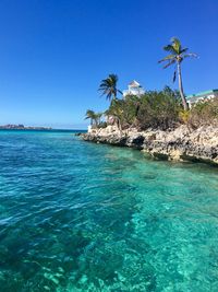 Scenic view of sea against clear blue sky