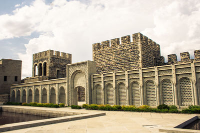 Fortress against cloudy sky