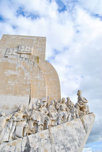 Low angle view of statue against cloudy sky