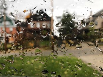 Full frame shot of wet glass window in rainy season