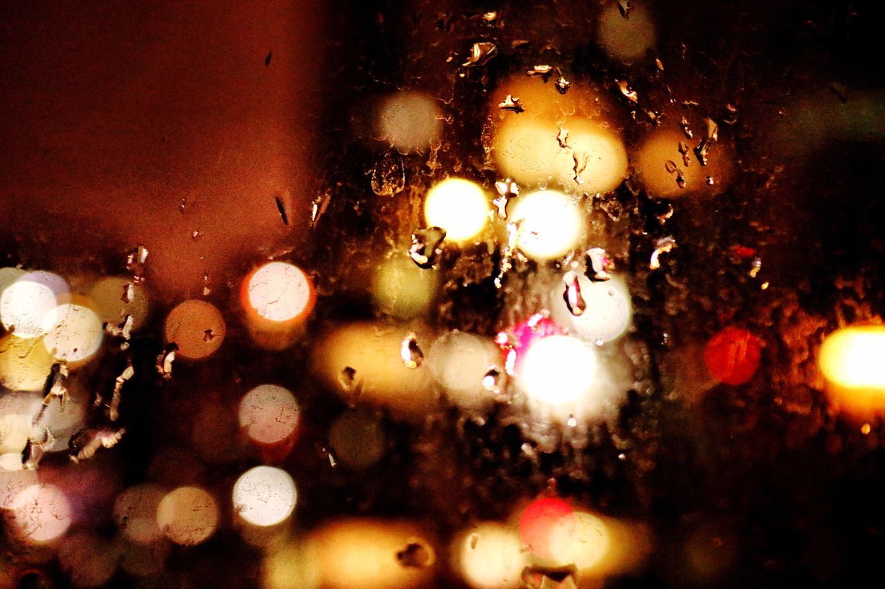 indoors, illuminated, close-up, no people, night, water, glass - material, wet, holiday, full frame, transparent, drop, selective focus, decoration, lighting equipment, christmas decoration, lens flare, christmas, window, christmas ornament, light, raindrop