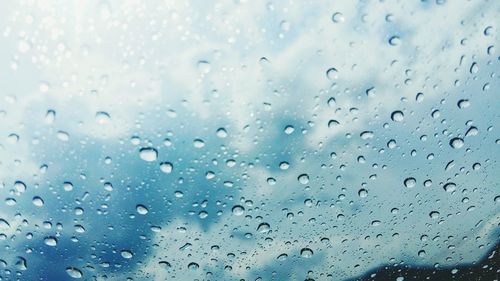 Full frame shot of raindrops on window