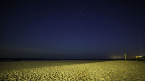 Scenic view of field against sky at night