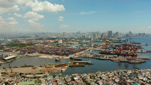 Cityscape of makati with sea port,the business center of manila, view from sea. asian metropolis. 